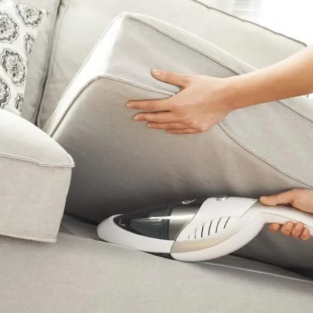remove dust particles from fabric sofa