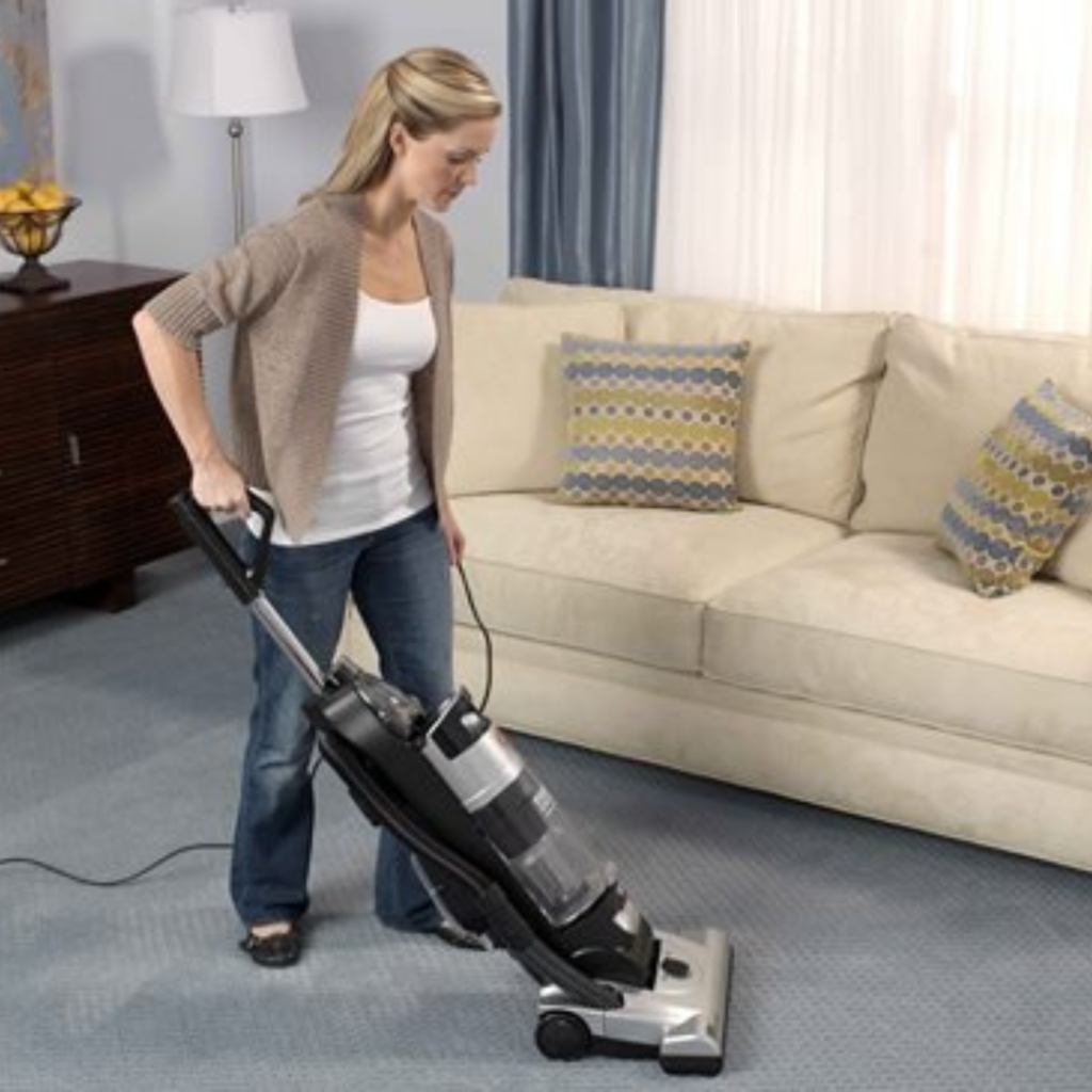 vacuuming a carpet